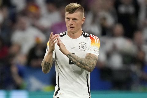 Germany's Toni Kroos applauds as he is substituted during a Group A match between Germany and Scotland at the Euro 2024 soccer tournament in Munich, Germany, Friday, June 14, 2024. (AP Photo/Matthias Schrader)