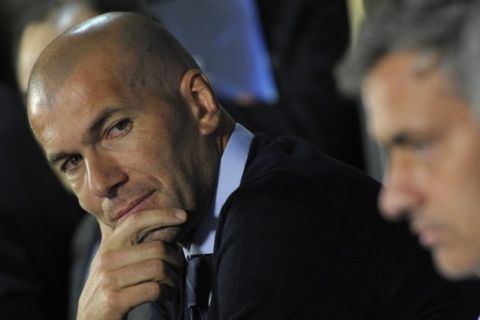 Former French football player Zinedine Zidane (L) looks to Real Madrid's Portuguese coach Jose Mourinho during a press conference at White Hart Lane stadium in London on April 12, 2011, on the eve of the Champions League quarter-final second leg football match against Tottenham Hotspur. AFP PHOTO/JAVIER SORIANO. (Photo credit should read JAVIER SORIANO/AFP/Getty Images)