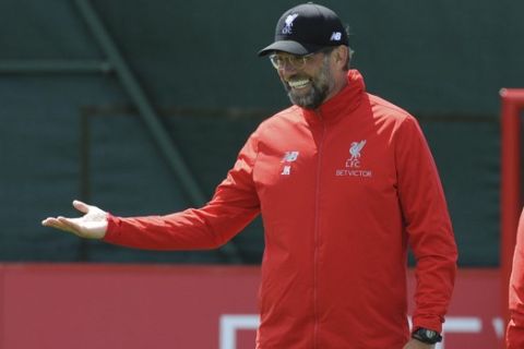 Liverpool head coach Juergen Klopp supervises a training session at the Liverpool soccer team media open day, in Liverpool, England, Tuesday, May 28, 2019, ahead of their Champions League Final soccer match against Tottenham on Saturday in Madrid. (AP Photo/Rui Vieira)