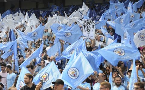 Manchester City fans cheer prior to the English Premier League soccer match between Manchester City and Huddersfield Town at Etihad stadium in Manchester, England, Sunday, May 6, 2018. (AP Photo/Rui Vieira)