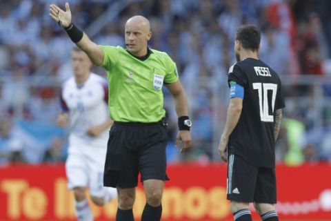 Referee Szymon Marciniak of Poland gestures during the group D match between Argentina and Iceland at the 2018 soccer World Cup in the Spartak Stadium in Moscow, Russia, Saturday, June 16, 2018. (AP Photo/Victor Caivano)