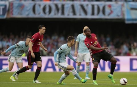 Manchester United's Paul Pogba, right, controls the ball during a Europa League, semifinal, first leg soccer match between Celta and Manchester United at the Balaidos stadium in Vigo, Spain, Thursday May 4, 2017. (AP Photo/Lalo R. Villar)