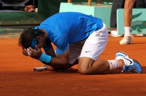 PARIS, FRANCE - JUNE 05:  Rafael Nadal of Spain celebrates match point during the men's singles final match between Rafael Nadal of Spain and Roger Federer of Switzerland on day fifteen of the French Open at Roland Garros on June 5, 2011 in Paris, France.  (Photo by Matthew Stockman/Getty Images)