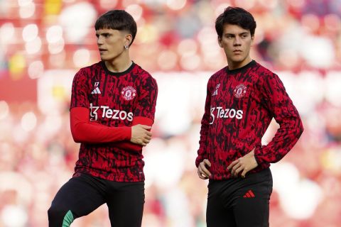 Manchester United's Alejandro Garnacho, from left, Manchester United's Facundo Pellistri and Hannibal Mejbri pause during warm up before the English Premier League soccer match between Manchester United and Brentford at the Old Trafford stadium in Manchester, England, Saturday, Oct. 7, 2023.(AP Photo/Jon Super)