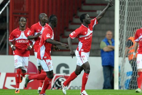 20110421 - LIEGE, BELGIUM: (L-R) Standard's Mbaye Leye celebrates during the Jupiler Pro League match between Standard de Liege and Sporting Lokeren, in Liege, Thursday 21 April 2011, on the 4th day of the Play-off 1 of the Belgian soccer championship. BELGA PHOTO YORICK JANSENS