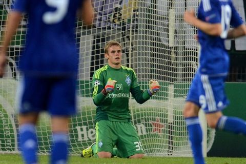 Kyiv´s goalkeeper Maxym Koval reacts after the Champions League Play-off round 1 st leg football match Borussia Moenchengladbach vs FC Dynamo Kyiv on August 21, 2012 in Moenchengladbach, western Germany .Kyiv won 3-1. AFP PHOTO / PATRIK STOLLARZ        (Photo credit should read PATRIK STOLLARZ/AFP/GettyImages)