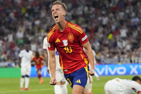 Spain's Dani Olmo celebrates after scoring his side's second goal during a semifinal match between Spain and France at the Euro 2024 soccer tournament in Munich, Germany, Tuesday, July 9, 2024. (AP Photo/Manu Fernandez)