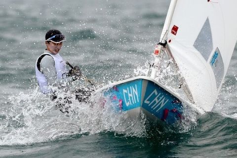 China's Xu Lijia prepares to round the mark in the Laser Radial sailing class at the London 2012 Olympic Games, in Weymouth on August 4, 2012.  AFP PHOTO/William WEST        (Photo credit should read WILLIAM WEST/AFP/GettyImages)