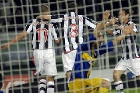 Juventus 's players celebrate after David Trezeguet, left, scored during the Italian Serie A major league make-up match between Juventus and Parma at the Olympic Stadium in Turin, Wednesday, April 16, 2008. At center is Giorgio Chiellini; at right, Mauro German Camoranesi. (AP Photo/Massimo Pinca)