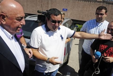 Sport Director Adriano Galliani of AC Milan, left, and Ibrahimovic's agent Mino Raiola, center, leave the Camp Nou stadium in Barcelona, Spain, Thursday, Aug. 26, 2010. Adriano Galliani, Chief Executive Officer of AC Milan soccer club met Barcelona FC President Sandro Rosell today at noon to negotiate the acquisition of the Swedish striker Zlatan Ibrahimovic. (AP Photo/Manu Fernandez)