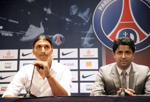 Paris Saint-Germain (PSG) football club's newly recruited Sweden striker Zlatan Ibrahimovic (L) and Paris Saint-Germain (PSG) football club's chairman Nasser Al-Khelaifi give a press conference as part of Ibrahimovic's official presentation at the Parc des Princes on July 18, 2012 in Paris.  AFP PHOTO / BERTRAND GUAY        (Photo credit should read BERTRAND GUAY/AFP/GettyImages)