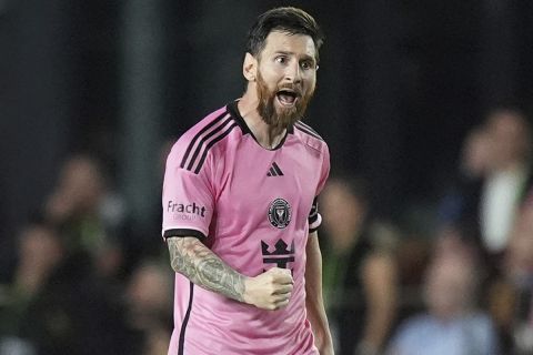 Inter Miami forward Lionel Messi (10) celebrates after scoring a goal during the second half of an MLS playoff opening round soccer match against Atlanta United, Saturday, Nov. 9, 2024, in Fort Lauderdale, Fla. (AP Photo/Rebecca Blackwell)