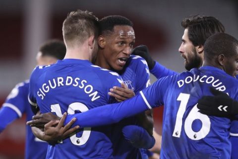 Everton's Gylfi Sigurdsson, center left, celebrates with teammates after scoring his side's first goal during the English Premier League soccer match between Sheffield United and Everton at the Bramall Lane stadium in Sheffield, England, Saturday, Dec. 26, 2020. (Alex Pantling/Pool via AP)