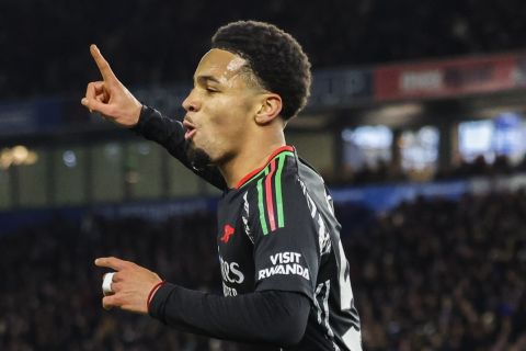 Arsenal's Ethan Nwaneri celebrates after scoring the opening goal during the English Premier League soccer match between Brighton and Hove Albion FC and Arsenal at the Amex stadium in Brighton, Saturday, Jan. 4, 2025. (AP Photo/Ian Walton)