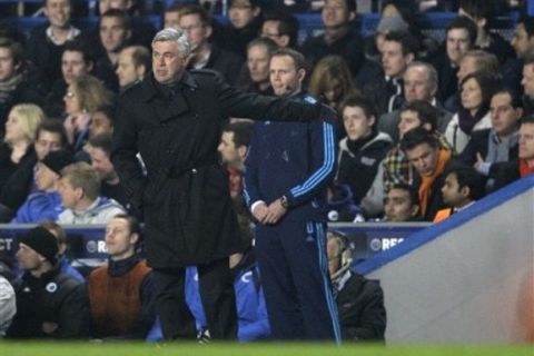 Chelsea's manager Carlo Ancelotti gestures as he watches his team play FC Copenhagen during a Champions League, round of 16, second leg soccer match at Chelsea's Stamford Bridge stadium in London, Wednesday, March, 16, 2011.(AP Photo/Sang Tan)