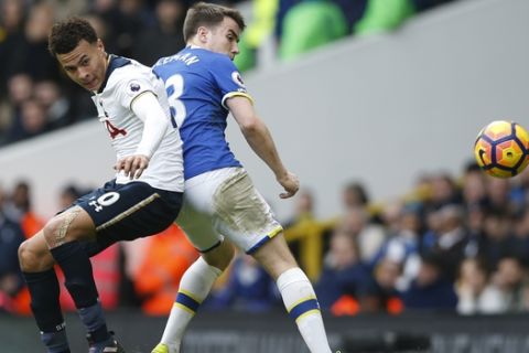 Tottenham Hotspur's Dele Alli, left, and Everton's Séamus Coleman vie for the ball during the English Premier League soccer match between Tottenham Hotspur and Everton at White Hart Lane in London, Sunday, March 5, 2017. (AP Photo/Alastair Grant)