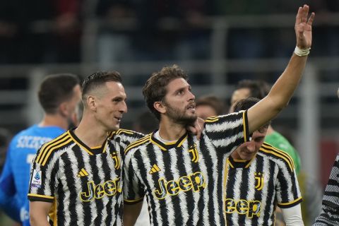 Juventus' Manuel Locatelli, right, celebrate after a Serie A soccer match between AC Milan and Juventus, at the San Siro stadium in Milan, Italy, Sunday, Oct. 22, 2023. Juventus won 1-0. (AP Photo/Luca Bruno)