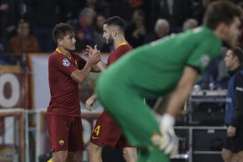 Roma forward Cengiz Under, left, celebrates with teammate Alessandro Florenzi after scoring his side's third goalduring a Champions League, Group G soccer match between AS Roma and CSKA Moscow, at the Olympic stadium in Rome, Tuesday, Oct. 23, 2018. (AP Photo/Gregorio Borgia)