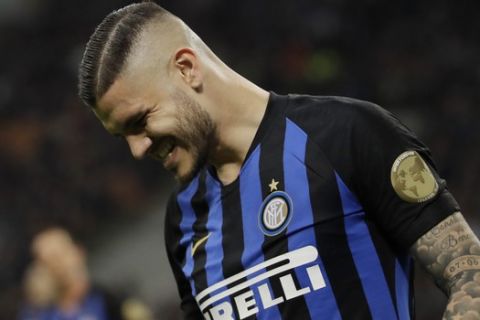 Inter Milan's Mauro Icardi grimaces during a Serie A soccer match between Inter Milan and Chievo, at the San Siro stadium in Milan, Italy, Monday, May 13, 2019. (AP Photo/Luca Bruno)