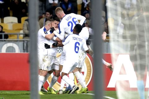 Dynamo Kyiv's players celebrate their goal scored by Dynamo Kyiv's Mykola Shaparenko during the UEFA Europa League group K soccer match between Rennes and Dynamo Kiev at the Olympiyskiy stadium in Kiev, Ukraine, Thursday, Nov. 8, 2018. (AP Photo/Efrem Lukatsky)