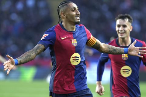 Barcelona's Raphinha celebrates after scoring his side's second goal during a Spanish La Liga soccer match between Barcelona and Espanyol at the Lluis Companys Olympic Stadium in Barcelona, Spain, Sunday, Nov. 3, 2024. (AP Photo/Joan Monfort)