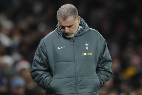 Tottenham's head coach Ange Postecoglou reacts during the English Premier League soccer match between Tottenham and Liverpool at Tottenham Hotspur Stadium in London, Sunday, Dec. 22, 2024. (AP Photo/Dave Shopland)