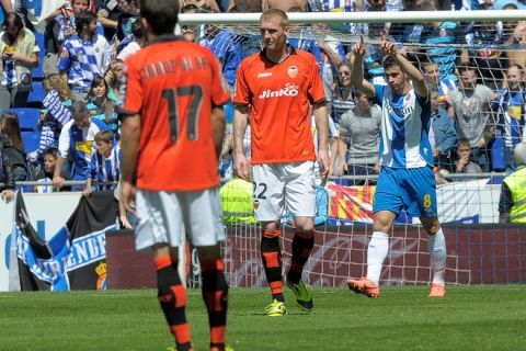 Espanyol's forward Alvaro Vazquez Garcia (R) celebrates after scoring during the Spanish league football match between RCD Espanyol and Valencia CF at the Cornella-El Prat stadium in Cornella on April 15, 2012.   AFP PHOTO/ JOSEP LAGO (Photo credit should read JOSEP LAGO/AFP/Getty Images)