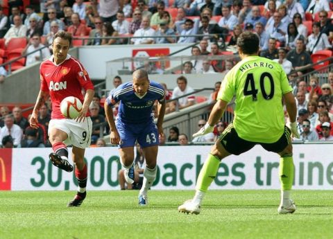 Manchester United's  Bulgarian striker Dimitar Berbatov (L) scores the third goal during the FA Community Shield football match against Chelsea at Wembley Stadium in London, England, on August 8, 2010. AFP PHOTO/GLYN KIRK

RESTRICTED FOR EDITORIAL USE/ NO COMMERCIAL USE (Photo credit should read GLYN KIRK/AFP/Getty Images)(Photo Credit should Read /AFP/Getty Images)