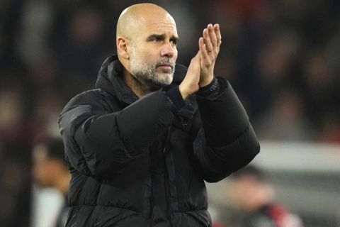 Manchester City's head coach Pep Guardiola applauds his sides fans after the end of the English Premier League soccer match between Bournemouth and Manchester City at the Vitality stadium in Bournemouth, England, Saturday, Nov. 2, 2024 Bournemouth won the game 2-1. (AP Photo/Kirsty Wigglesworth)