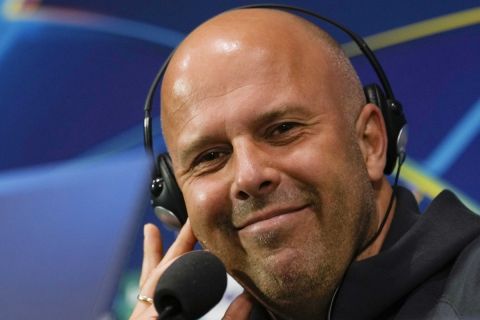 Liverpool's coach Arne Slot smiles during a news conference at the San Siro Stadium, in Milan, Italy, Monday, Sept. 16, 2024, ahead of the Champions League soccer match between A.C. Milan and Liverpool on Tuesday. (AP Photo/Luca Bruno)