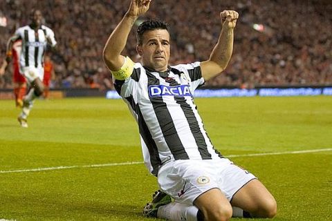 Udinese's Antonio Di Natale celebrates after scoring against Liverpool, during their Europa League Group A soccer match at Anfield Stadium, Liverpool, England, Thursday Oct. 4, 2012. (AP Photo/Jon Super)