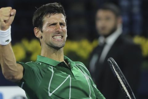 Serbia's Novak Djokovic celebrates after he beats Stefanos Tsitsipas of Greece in the final match of the Dubai Duty Free Tennis Championship in Dubai, United Arab Emirates, Saturday, Feb. 29, 2020. (AP Photo/Kamran Jebreili)