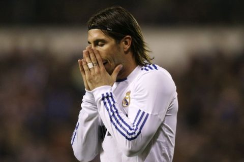 Real Madrid's Sergio Ramos reacts during their Spanish First Division soccer match against Deportivo Coruna at Riazor stadium in Coruna February 26, 2011. REUTERS/Miguel Vidal  (SPAIN - Tags: SPORT SOCCER)