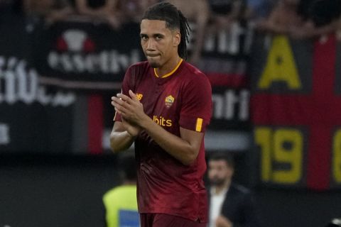 Roma's Chris Smalling applauds after scoring the opening goal of his team during the Italian Serie A soccer match between Roma and Cremonese at the Olympic Stadium in Rome, Italy, Monday, Aug. 22, 2022. (AP Photo/Gregorio Borgia)