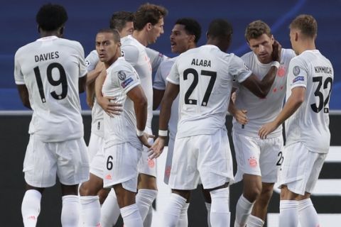 Bayern's Thomas Mueller, 2nd right, celebrates with teammates after scoring his sides first goal during the Champions League quarterfinal match between FC Barcelona and Bayern Munich at the Luz stadium in Lisbon, Portugal, Friday, Aug. 14, 2020. (AP Photo/Manu Fernandez/Pool)