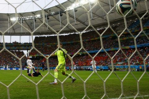 SALVADOR, BRAZIL - JUNE 13:  Iker Casillas of Spain watches as a header from Robin van Persie of the Netherlands goes over his head for a goal in the first half during the 2014 FIFA World Cup Brazil Group B match between Spain and Netherlands at Arena Fonte Nova on June 13, 2014 in Salvador, Brazil.  (Photo by Dean Mouhtaropoulos/Getty Images)