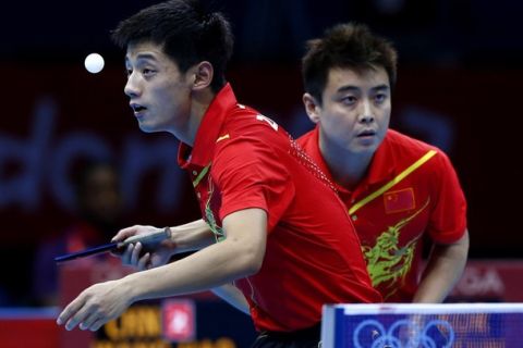 China's Zhang Jike (L) and team mate Wang Hao compete in their men's team gold medal table tennis doubles match against South Korea's Ryu Seungmin and team mate Oh Sangeun at the ExCel venue during the London 2012 Olympic Games August 8, 2012.   REUTERS/Grigory Dukor (BRITAIN  - Tags: SPORT OLYMPICS SPORT TABLE TENNIS)  