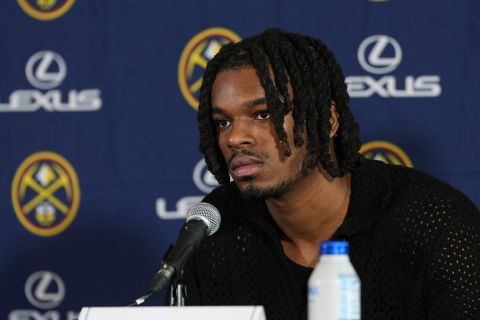 Denver Nuggets 2024 first-round draft pick DaRon Holmes II speaks during an introductory news conference at the NBA basketball team's arena Monday, July 1, 2024, in Denver. (AP Photo/David Zalubowski)