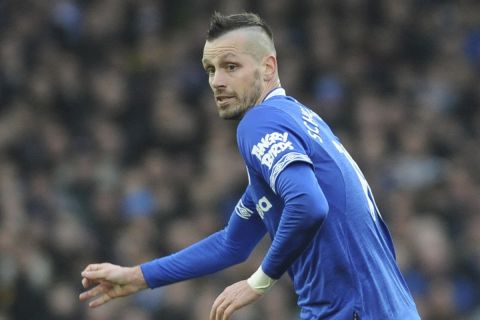 Liverpool's Georginio Wijnaldum, right, challenges for the ball with Everton's Morgan Schneiderlin during the English Premier League soccer match between Everton and Liverpool at Goodison Park in Liverpool, England, Sunday, March 3, 2019. (AP Photo/Rui Vieira)