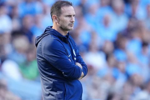 Chelsea's head coach Frank Lampard observes during the English Premier League soccer match between Manchester City and Chelsea at the Etihad Stadium in Manchester, England, Sunday, May 21, 2023. (AP Photo/Jon Super)