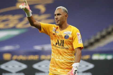 PSG's goalkeeper Keylor Navas celebrates after blocking a penalty kick to allow his team to win the French League Cup, following a soccer final match against Lyon at Stade de France stadium, in Saint Denis, north of Paris, Friday, July 31, 2020. (AP Photo/Francois Mori)