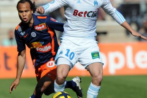 Marseille's French forward Andr-Pierre Gignac (R) vies with Montpellier's French defender Garry Bocaly (L) during their French L1 football match Montpellier vs Marseille, on April 17, 2011 at the Mosson stadium in Montpellier, southern France. AFP PHOTO / PASCAL GUYOT (Photo credit should read PASCAL GUYOT/AFP/Getty Images)