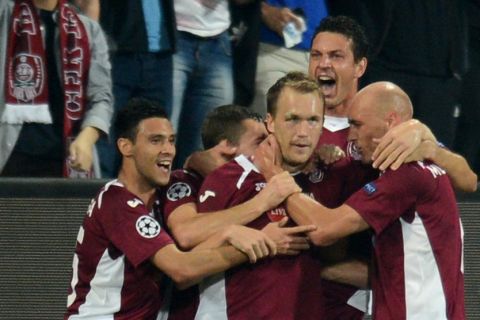 Cluj's Greek forward Pantelis Kapetanos (C) celebrates scoring with his teammates during the Champions League Group H football match CFR Cluj vs Manchester United in Cluj Napoca, Romania on October 2, 2012.  AFP PHOTO / DANIEL MIHAILESCU        (Photo credit should read DANIEL MIHAILESCU/AFP/GettyImages)