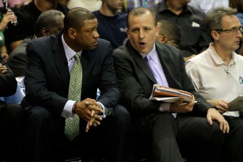 Boston Celtics head coach Doc Rivers, left, listens to assistant coach Tom Thibodeau during the first half against the Orlando Magic during Game 5 of the NBA Eastern Conference basketball finals in Orlando, Fla. Wednesday May 26, 2010. Thibodeau is being considered for the New Orleans Hornets head coach job. (AP Photo/John Raoux)