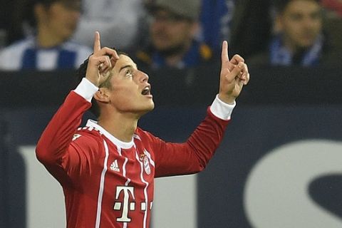 Bayern's James Rodriguez celebrates after scoring during the German Bundesliga soccer match between FC Schalke 04 and Bayern Munich at the Arena in Gelsenkirchen, Germany, Tuesday, Sept. 19, 2017. (AP Photo/Martin Meissner)