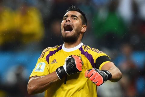 SAO PAULO, BRAZIL - JULY 09:  Sergio Romero of Argentina celebrates saving the penalty of Wesley Sneijder of the Netherlands in a shootout during the 2014 FIFA World Cup Brazil Semi Final match between the Netherlands and Argentina at Arena de Sao Paulo on July 9, 2014 in Sao Paulo, Brazil.  (Photo by Matthias Hangst/Getty Images)