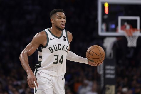 Milwaukee Bucks forward Giannis Antetokounmpo (34) looks to pass during the first half of an NBA basketball game against the New York Knicks Friday, Nov. 8, 2024, in New York. The Knicks won 116-94. (AP Photo/Adam Hunger)