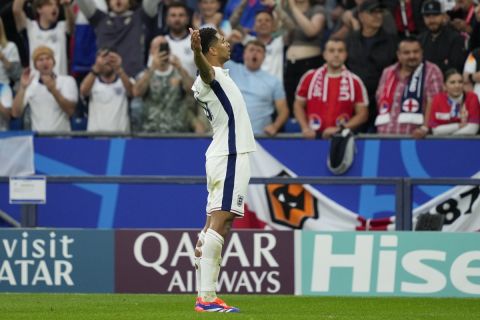 England's Jude Bellingham celebrates after scoring his side's opening goal during a Group C match between Serbia and England at the Euro 2024 soccer tournament in Gelsenkirchen, Germany, Sunday, June 16, 2024. (AP Photo/Andreea Alexandru)