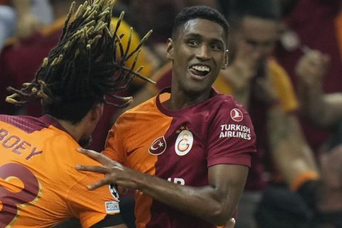 Galatasaray players celebrate with Tete, right, who scored his side's second goal during their Champions League Group A soccer match between Galatasaray and FC Copenhagen in Istanbul, Turkey, Wednesday, Sept. 20, 2023. (AP Photo/Francisco Seco)