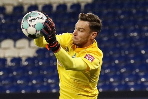 Bremen's goalkeeper Jiri Pavlenka catches the ball during the German Bundesliga soccer match between FC Schalke 04 and Werder Bremen in Gelsenkirchen, Germany, Saturday, Sept. 26, 2020. (AP Photo/Martin Meissner)